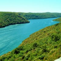 blue water and green hills of lim channel croatia