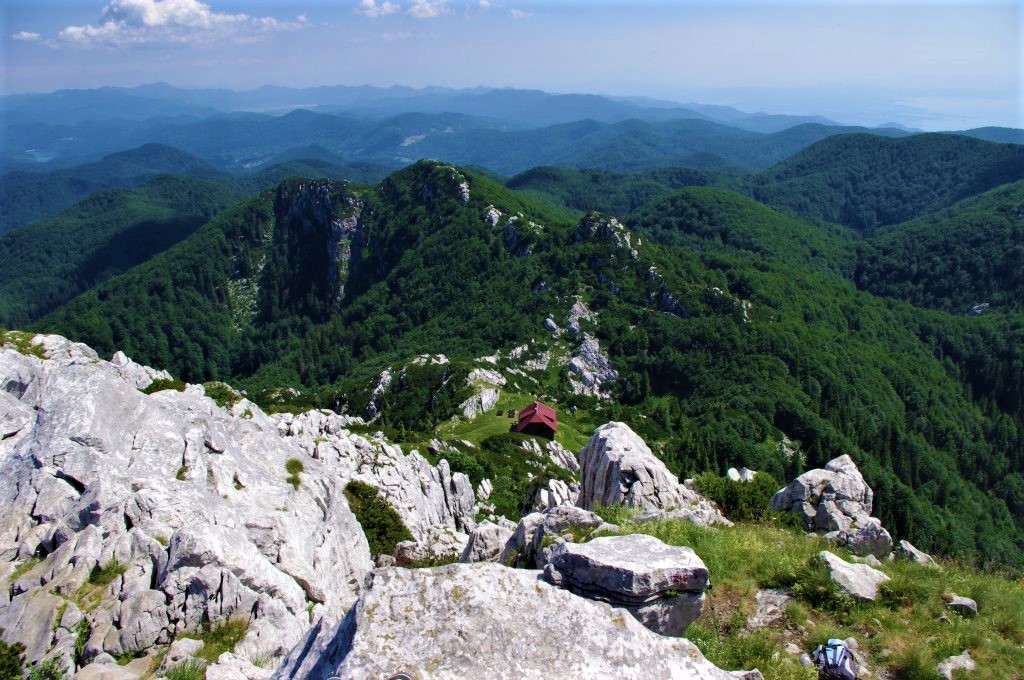 mountain hut and limestone peaks in risnjak national park